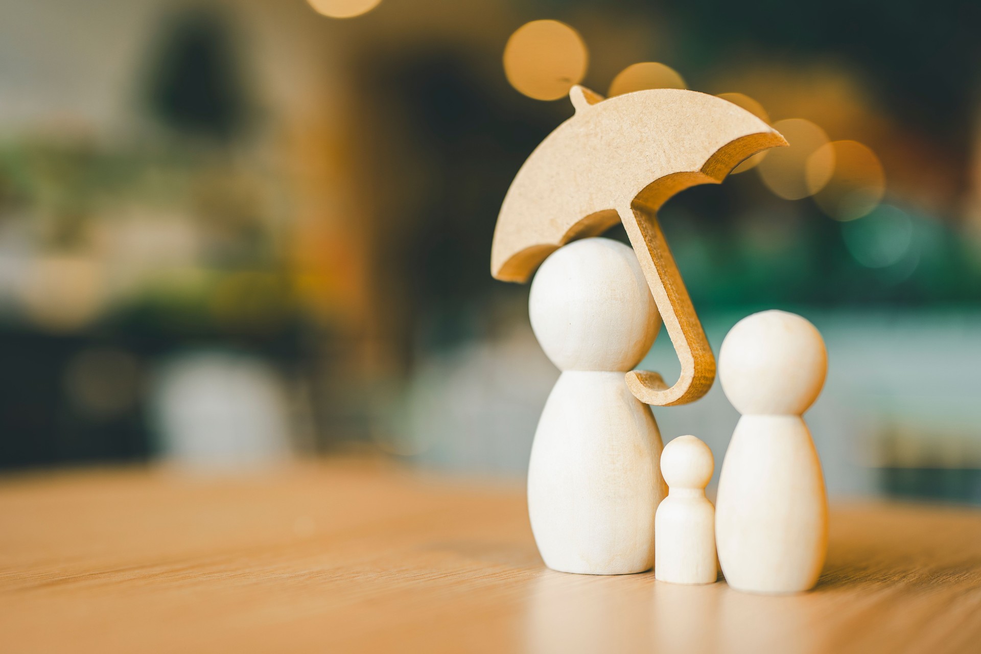 Umbrella icon and family model, Security protection and health insurance. The concept of family home, protection, health care day, car insurance.